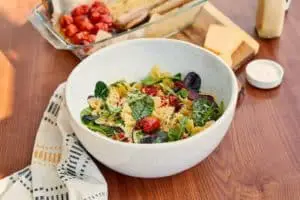 bowtie pasta salad with cherry tomato and cheese background