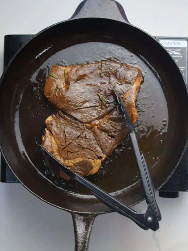 Marinated meat on cast-iron pan