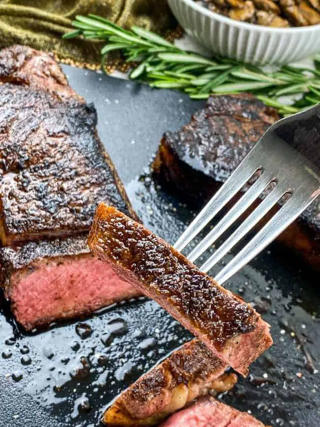 slice of strip steak on fork