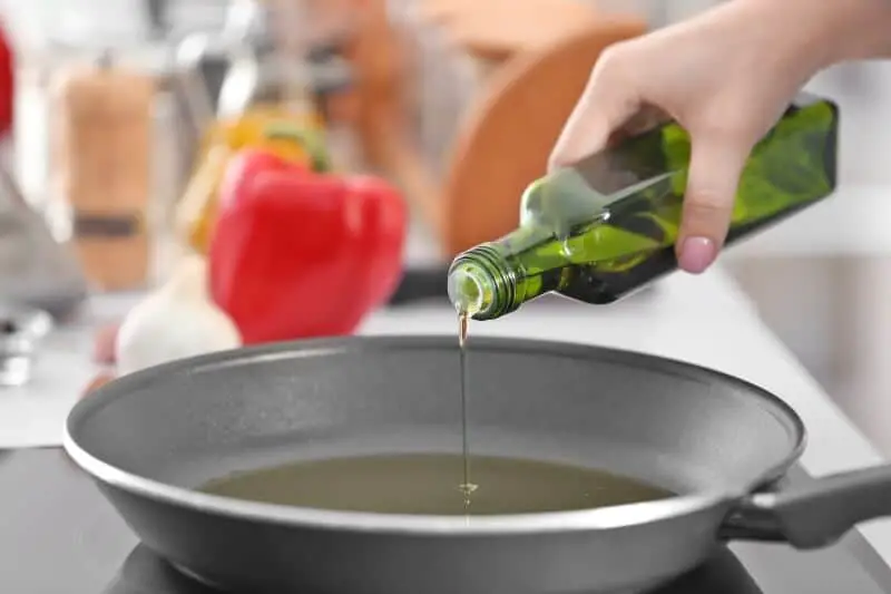 pouring oil in pan