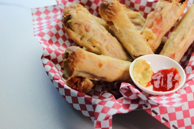 corn dogs with ketchup and mustard