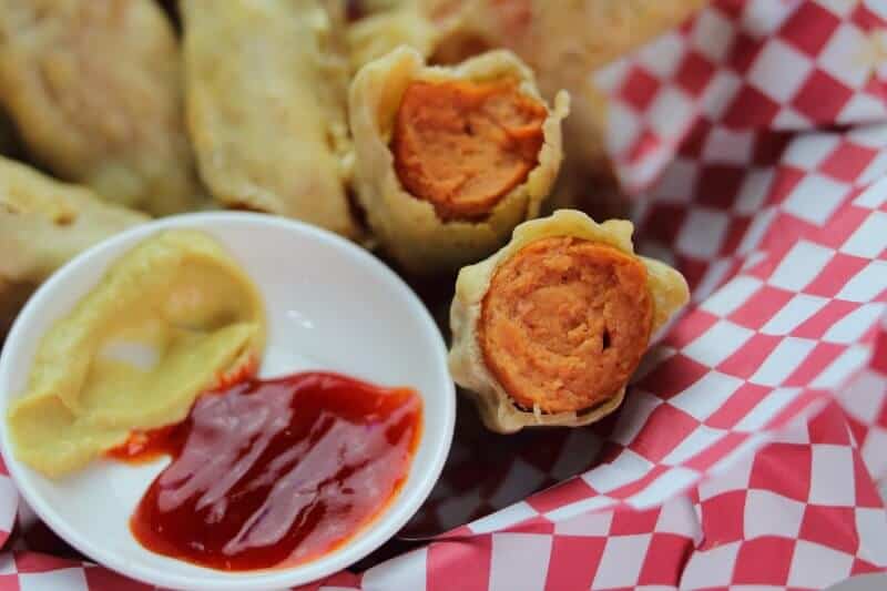 cooked corn dogs in half