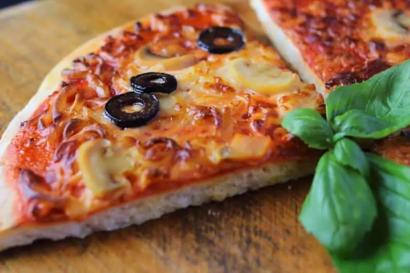 pizza with olive and mushroom topping 