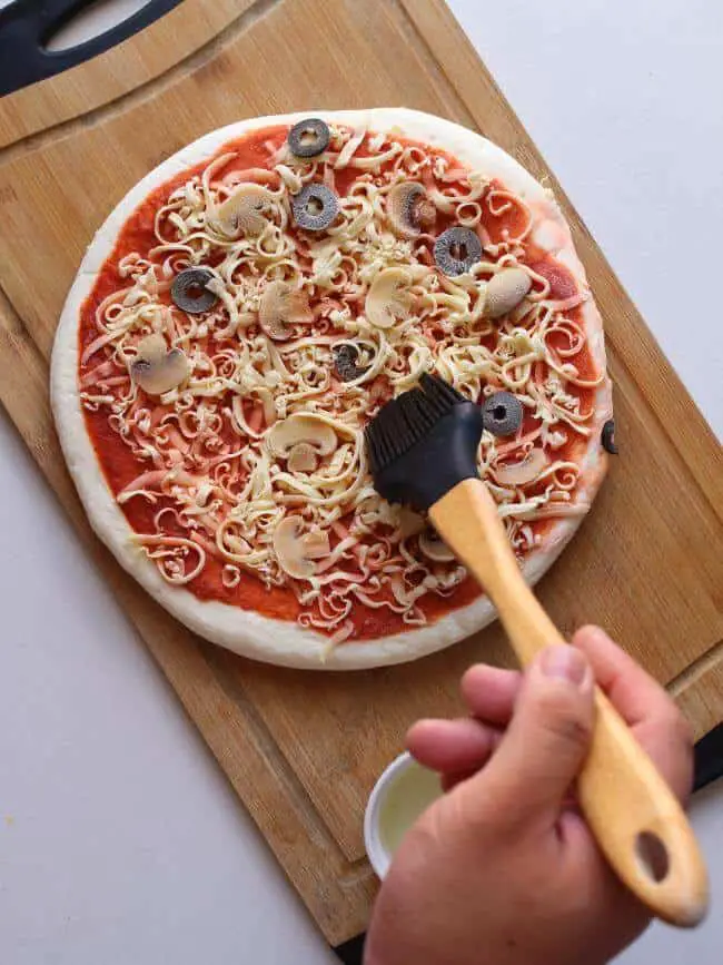 Brush Frozen Pizza with Oil