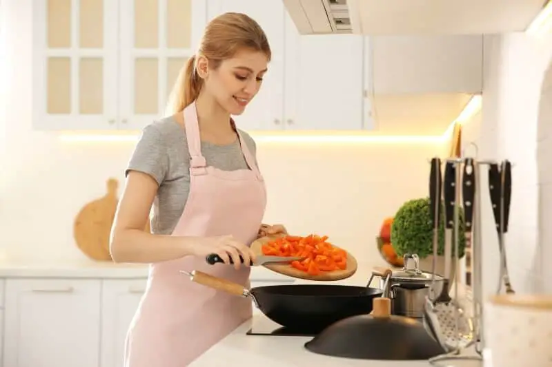 woman cooking vegetables