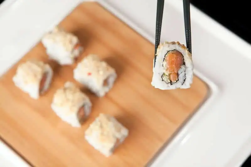 Sushi rice on chopsticks