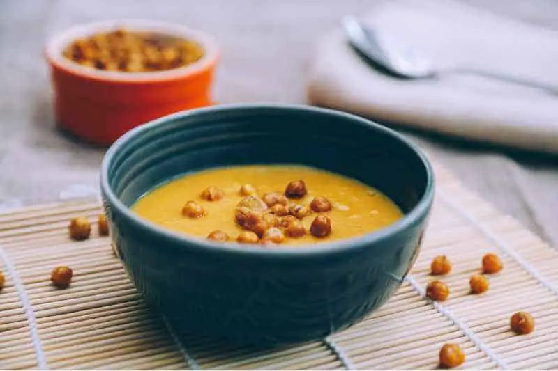 chickpea curry soup in blue bowl