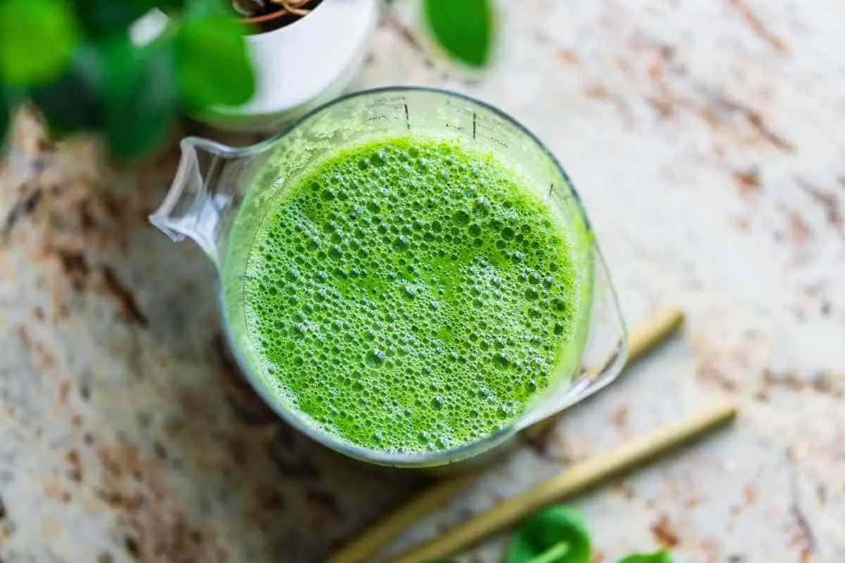 top view green smoothie in a blender