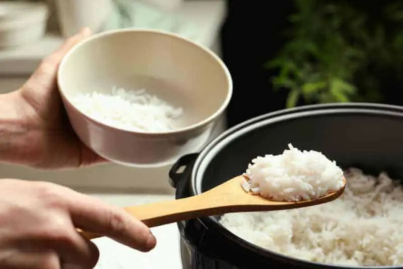 taking rice from rice cooker