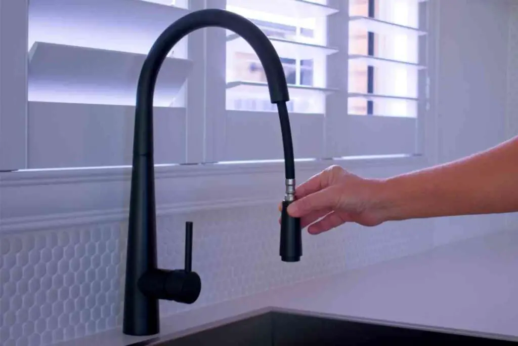 how to clean a pull down kitchen faucet spray head