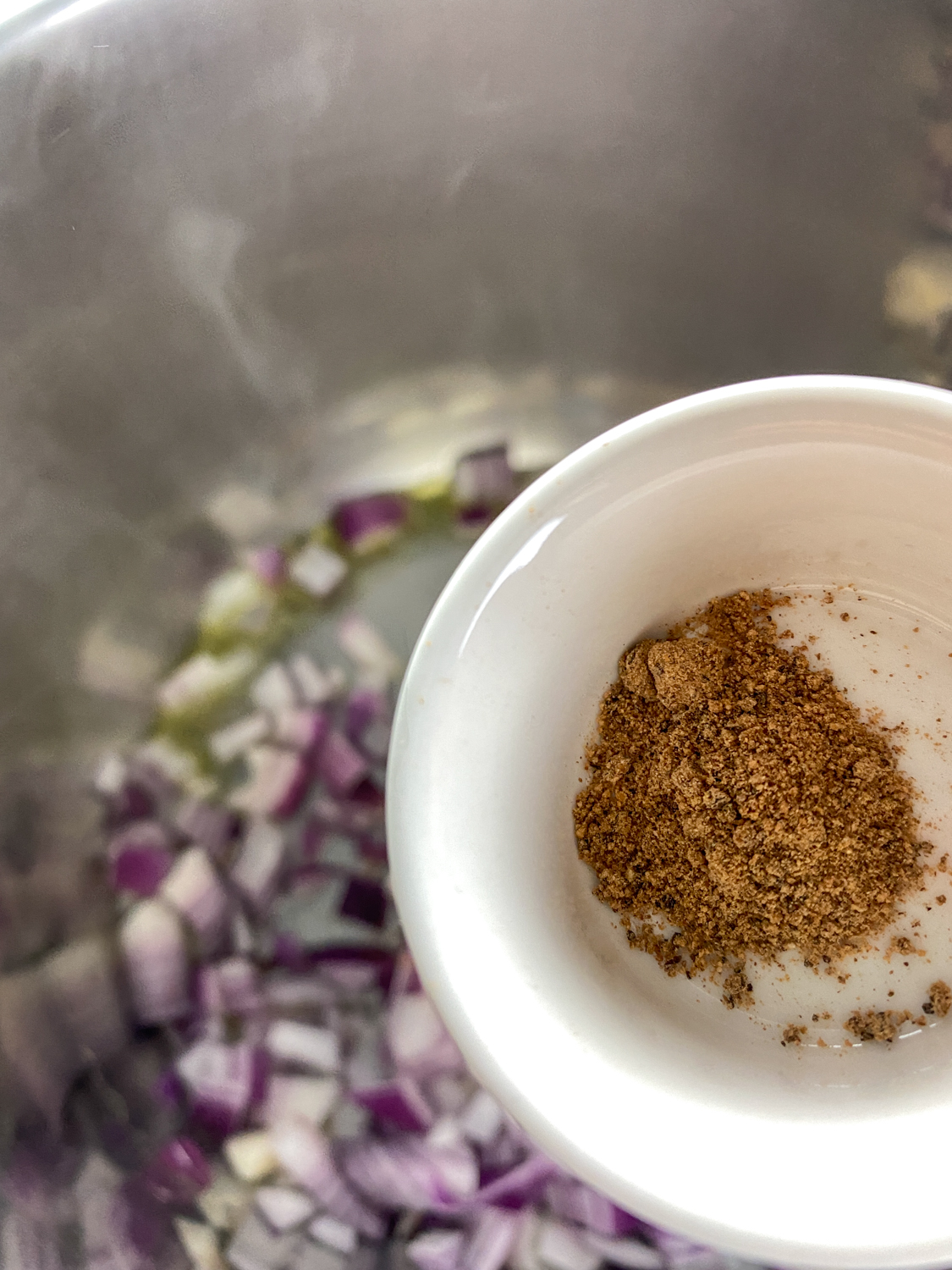 Add the freshly grated ginger, cinnamon, nutmeg, rosemary, and thyme.